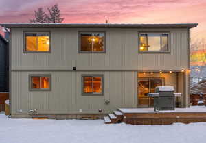 View of snow covered rear of property