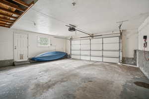 2 car garage with garage door opener and messanine for extra storage (Canoe is not for sale)