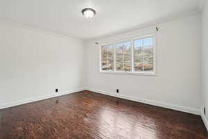 Main floor bedroom with view of back yard area