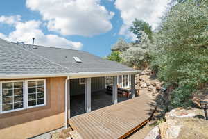 Backyard deck accessible from Kitchen and from sunroom, trex deck with specialty cutout for hot tub, new awning cover