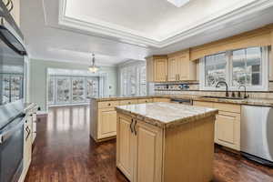 Kitchen with background dining room and sunroom