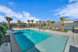 View of pool with a patio and a gazebo