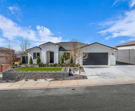 Ranch-style home featuring a garage