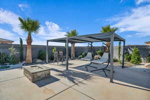 View of patio featuring a fire pit