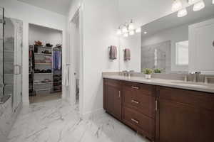 Bathroom with vanity and an enclosed shower