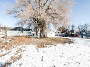 View of yard layered in snow