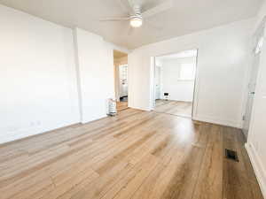 Unfurnished room featuring ceiling fan and light hardwood / wood-style floors