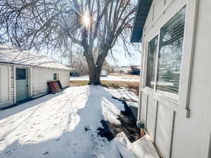 View of yard covered in snow