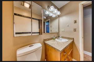 Bathroom with vanity and toilet