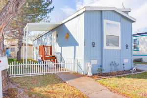 View of front of home with a carport