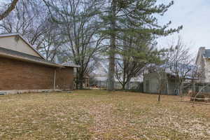 View of yard featuring a storage shed