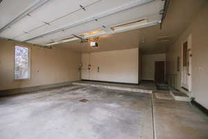 Garage featuring a garage door opener