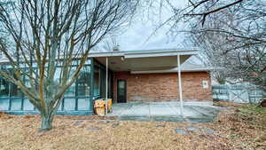 Rear view of property featuring a patio area