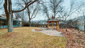 View of yard featuring a gazebo, a mountain view, and a patio area