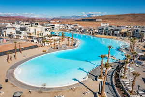 View of pool featuring a mountain view and a beach view