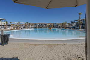 View of swimming pool featuring cooling unit