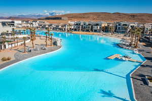 View of pool with a mountain view and a beach view