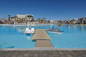 View of pool with a dock