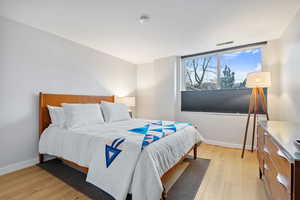 Bedroom with light wood-type flooring