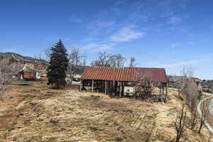 View of outbuilding with a carport and a mountain view