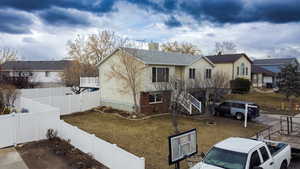 View of front of property with central AC unit