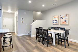 Dining room with hardwood / wood-style floors