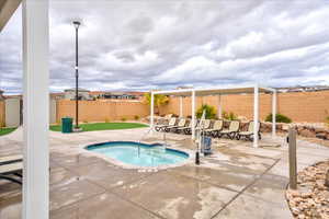 View of pool featuring an in ground hot tub and a patio area