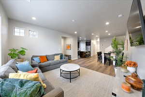 Living room with wood-type flooring