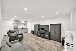 Basement kitchen with entertainment space for multiple functions, large storage at the back.