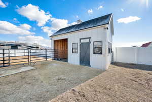 View of stable with side storage area.