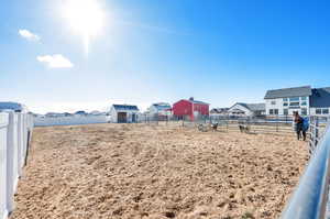 View of yard from nearby fence gate.