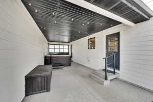 Breezeway with hot tub connection and access to the hallway or kitchen.