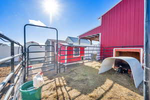 View of livestock areas and additional out buildings at the back of the barn.