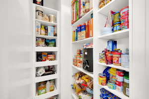 View of pantry with custom shelving.