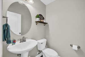 Bathroom featuring sink and toilet