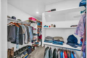 Walk in closet featuring carpet flooring