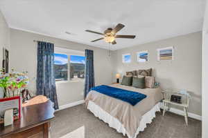 Bedroom with carpet floors and ceiling fan