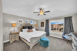 Bedroom featuring carpet floors and ceiling fan