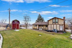 View of yard with a storage unit