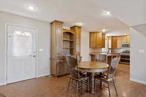 Dining room with hardwood / wood-style flooring