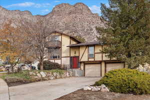 English style home with a mountain view and a garage