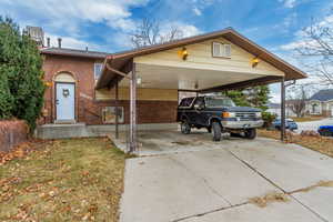 View of front of property featuring a carport