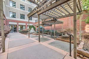 View of property's community with a pergola