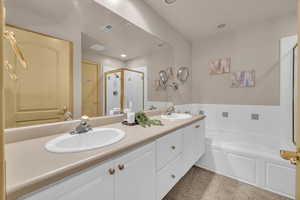 Bathroom with plus walk in shower and vanity