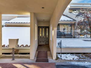 View of snow covered property entrance