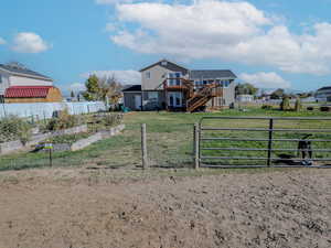 View of yard featuring a wooden deck