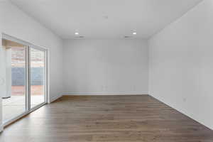 Spare room featuring dark hardwood / wood-style floors