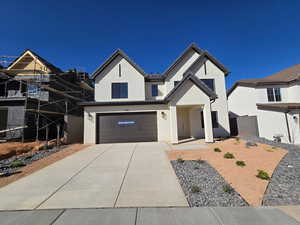 View of front of home featuring a garage