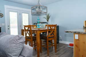 Dining space featuring dark wood-type flooring