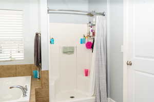 Bathroom featuring a shower with curtain